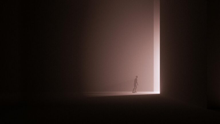 A lone human figure stands at the edge of a large, softly lit rectangular opening in an otherwise dark space. The light creates a stark contrast, casting long shadows and emphasising the scale of the surrounding darkness. The scene feels abstract and contemplative, suggesting uncertainty, transition, or the threshold between decision and outcome.